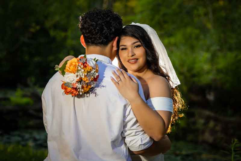 Bride and groom sharing a joyful moment on their wedding day, captured by JKPhotography Wedding Photographer