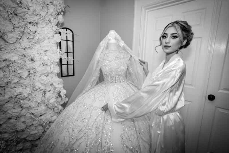 Bride and groom sharing a tender moment on their wedding day, captured by JKPhotography Wedding Photographer