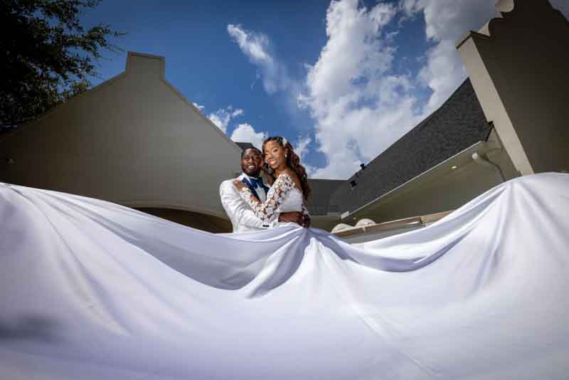 Bride and groom sharing a romantic moment on their wedding day, captured by JKPhotography Wedding Photographer